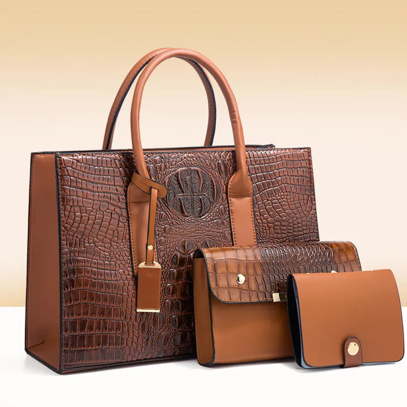 Women's three-piece PU leather handbag set with crocodile pattern in four colour options showing interior zippered compartment