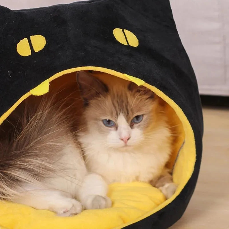 Soft plush covered cat cave bed with anti-slip bottom for cats and small dogs.