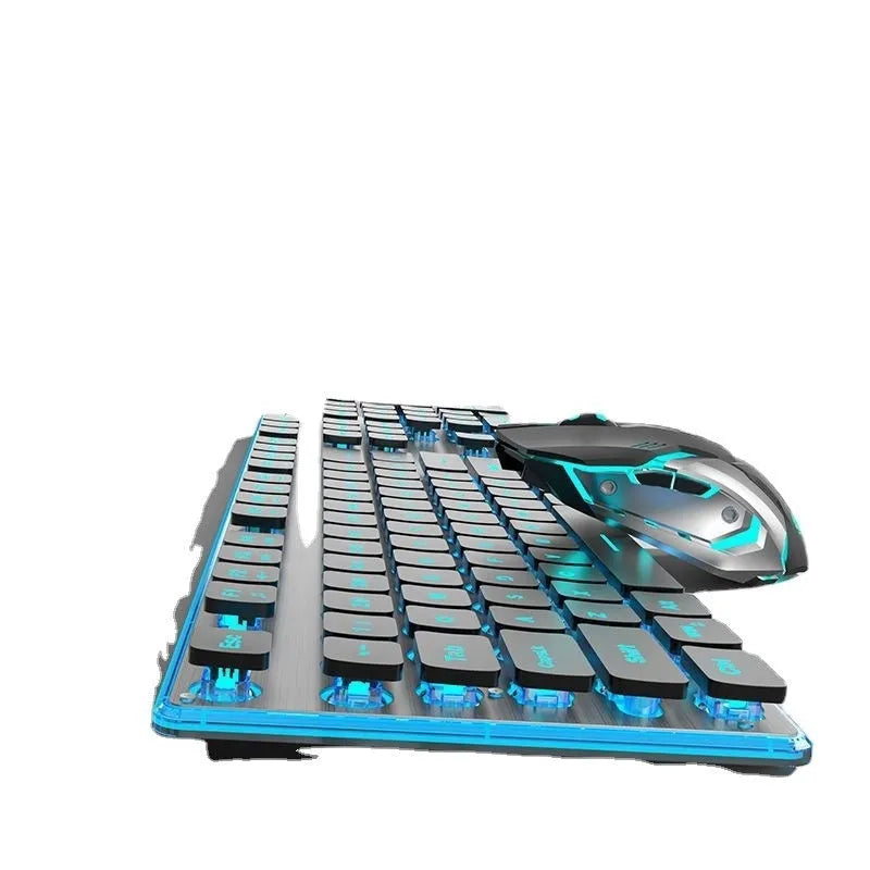 Compact wireless Bluetooth keyboard with mute button and pink backlight on a desk next to a tablet.