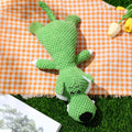 Green corn kernel shaped plush dog toy with a squeaker for interactive chewing and teeth cleaning