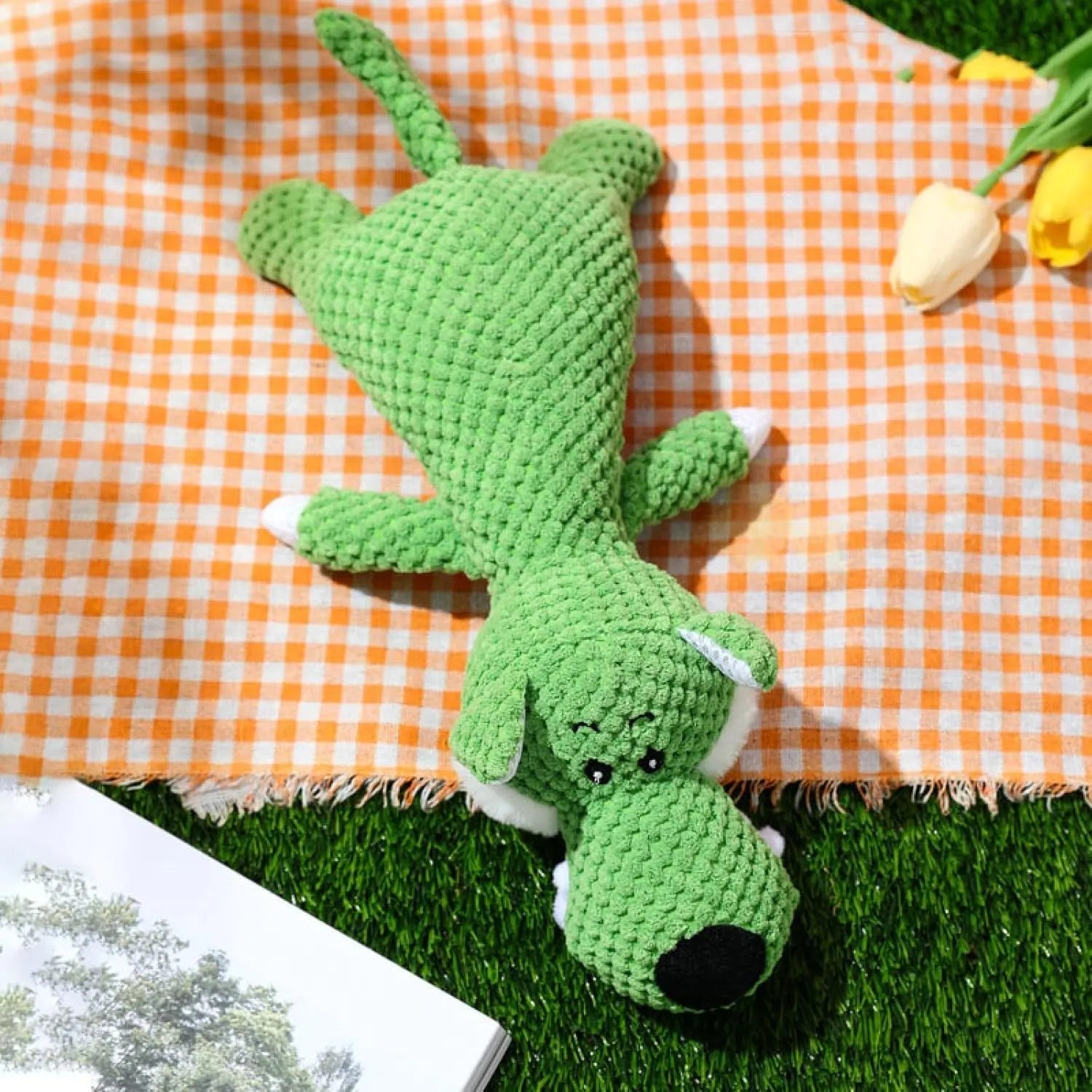 Green corn kernel shaped plush dog toy with a squeaker for interactive chewing and teeth cleaning