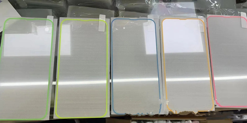 Luminous pink tempered glass screen protector fitted on an iPhone, showing full screen coverage and glow.