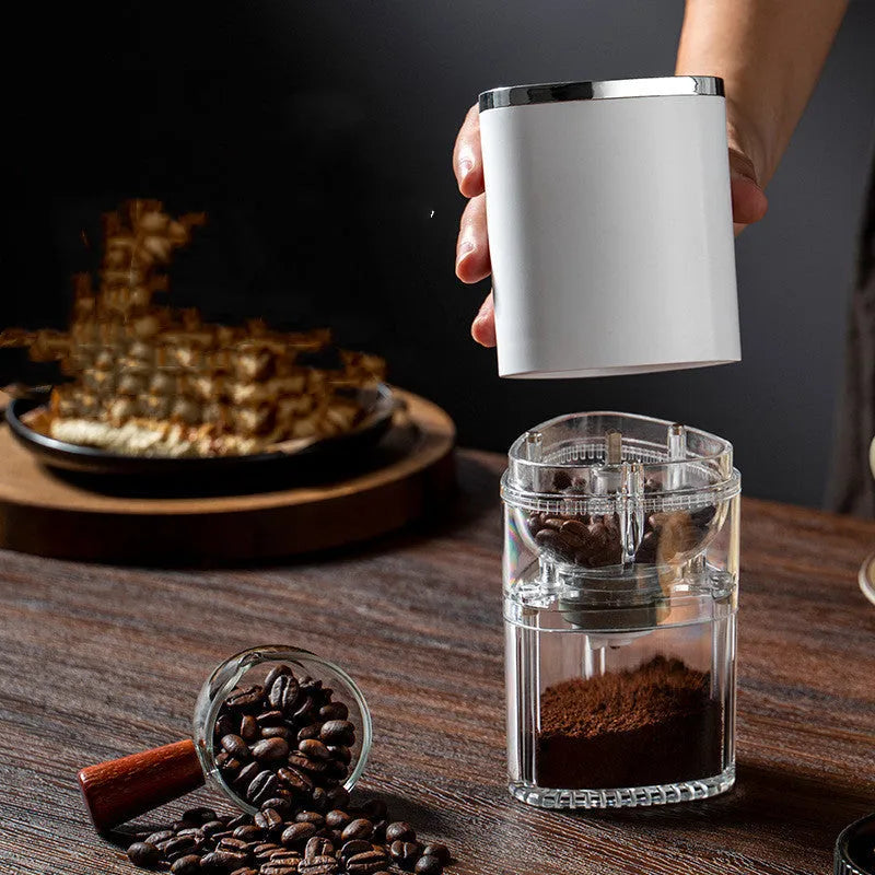 Portable USB rechargeable electric coffee grinder in black or white with ceramic burr.