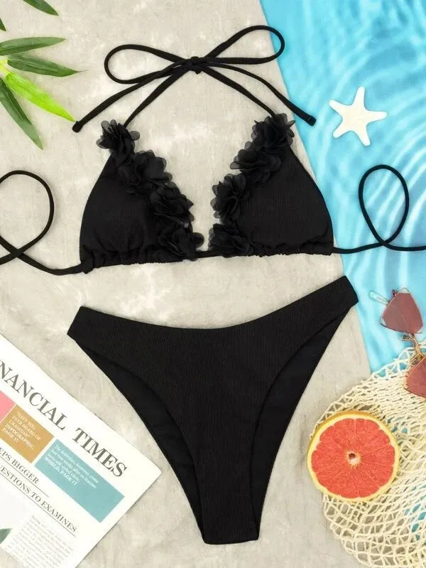 Black women's bikini set with gathered ruffle detail on top and matching shorts