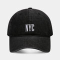 Retro style denim peaked cap with a large alphabet letter on the front, shown in light blue.