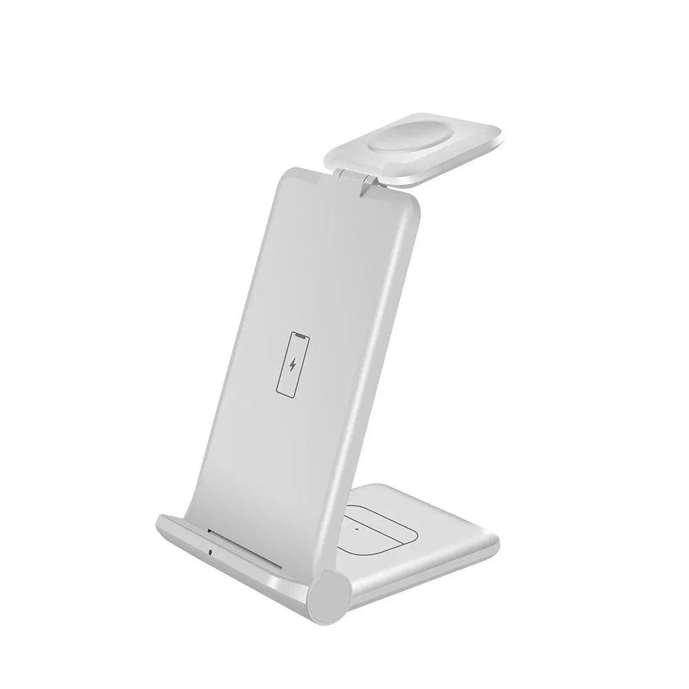 Black and white 3-in-1 wireless charging station for phone, watch, and earbuds on a desk.