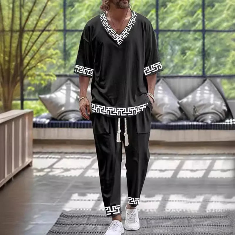 Lightweight polyester trousers suit with V-neck cropped sleeve jacket and matching trousers in multiple colours.