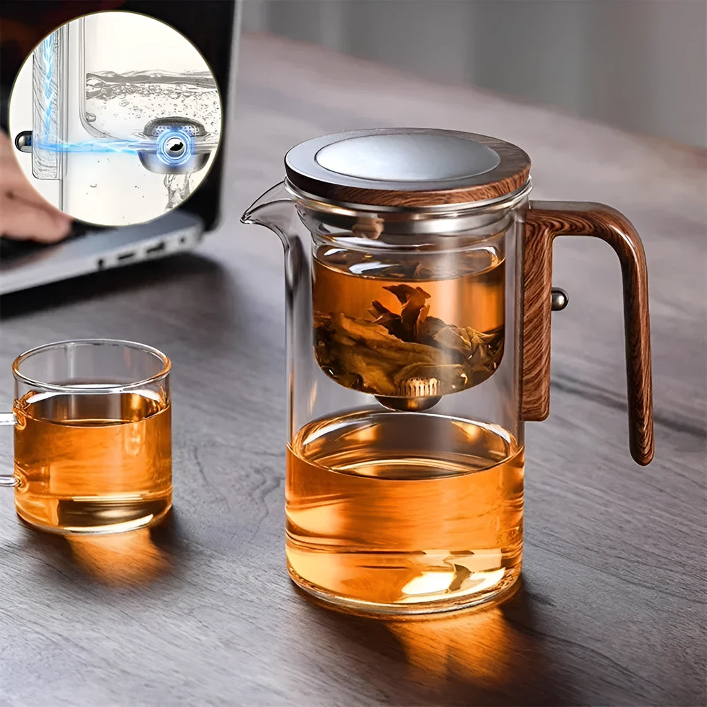 Glass teapot with wooden handle showing magnetic separation button and inner filter basket.