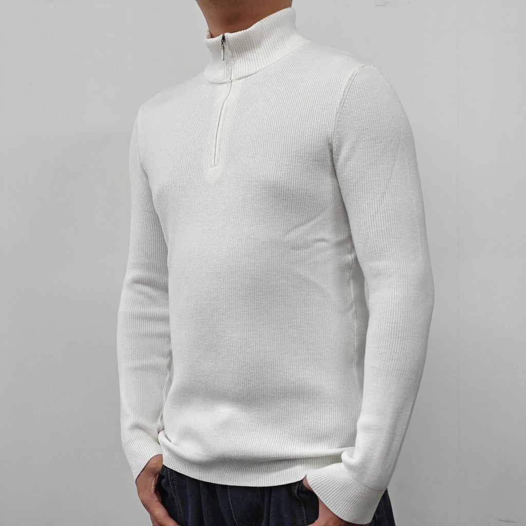 Man wearing a grey half turtleneck zip-front sweater, a casual cotton blend pullover.