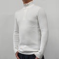 Man wearing a grey half turtleneck zip-front sweater, a casual cotton blend pullover.