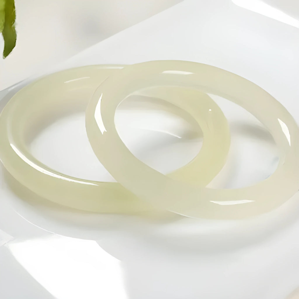 Round bar jade bracelet showing smooth geometric shape and cool stone finish.