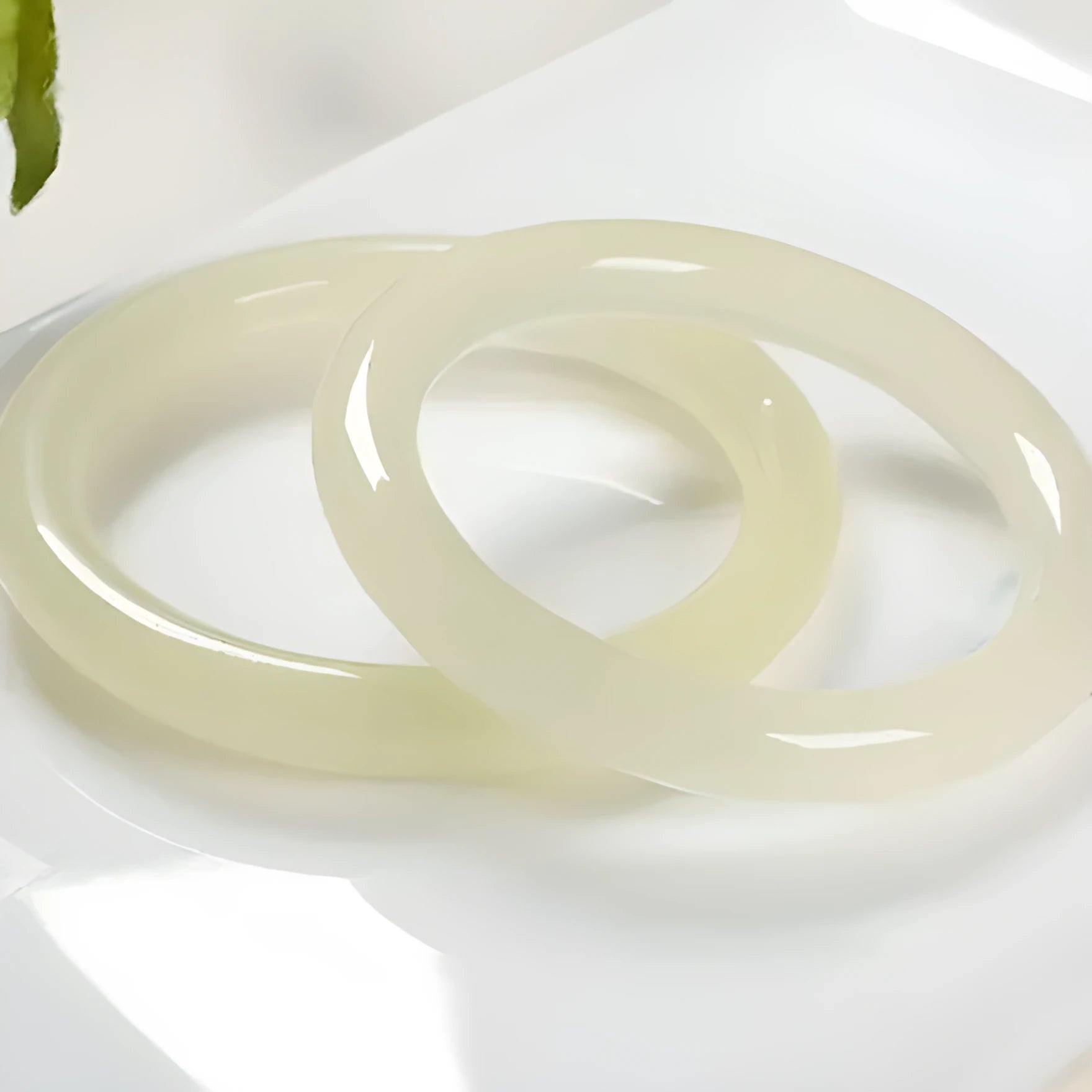 Round bar jade bracelet showing smooth geometric shape and cool stone finish.