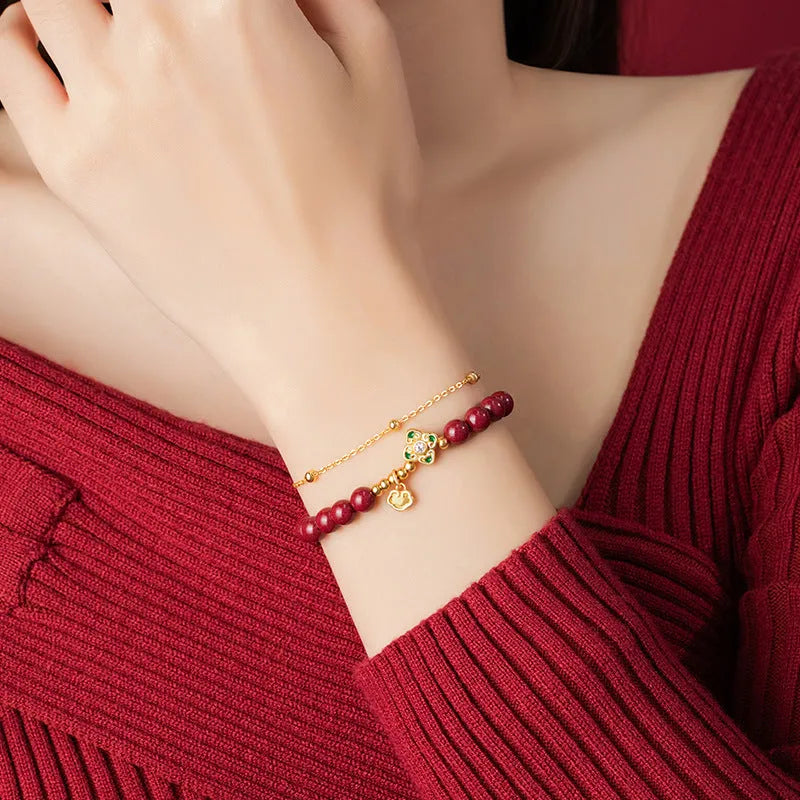 Sterling silver women's bracelet with Ruyi and Xiangyun motifs and cinnabar flower details