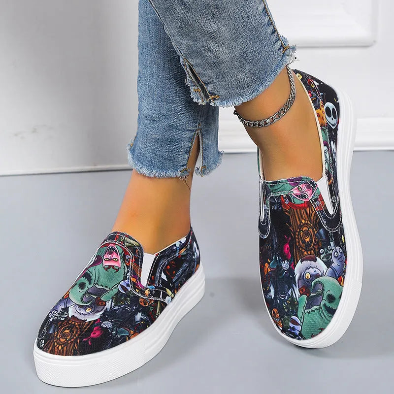 Women's blue colour match canvas trainers with flat rubber sole on a white background.