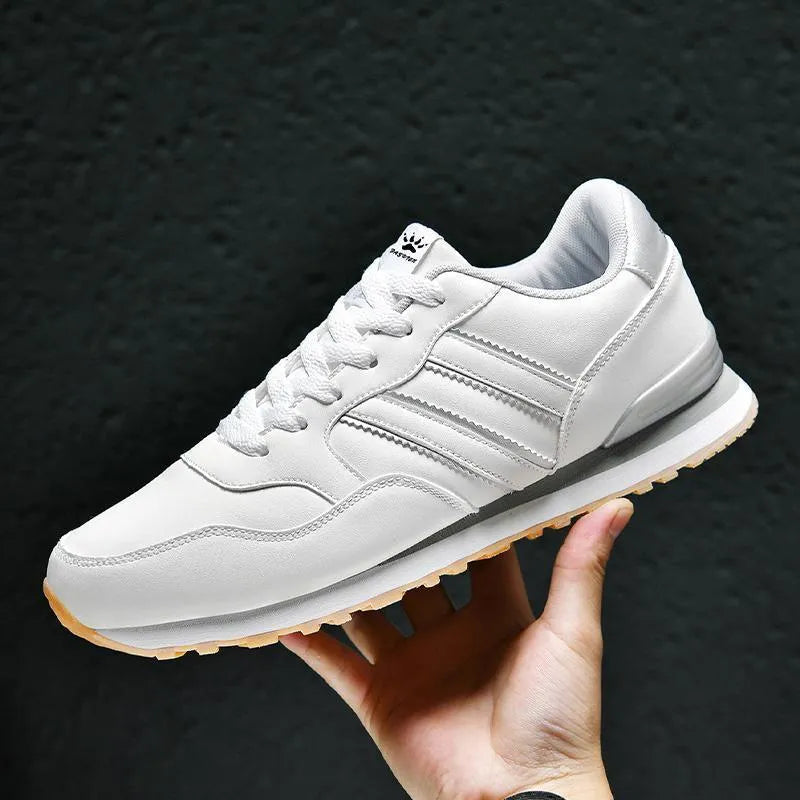 Black men's sports casual leather shoes with a carved wing pattern and a super high heel.