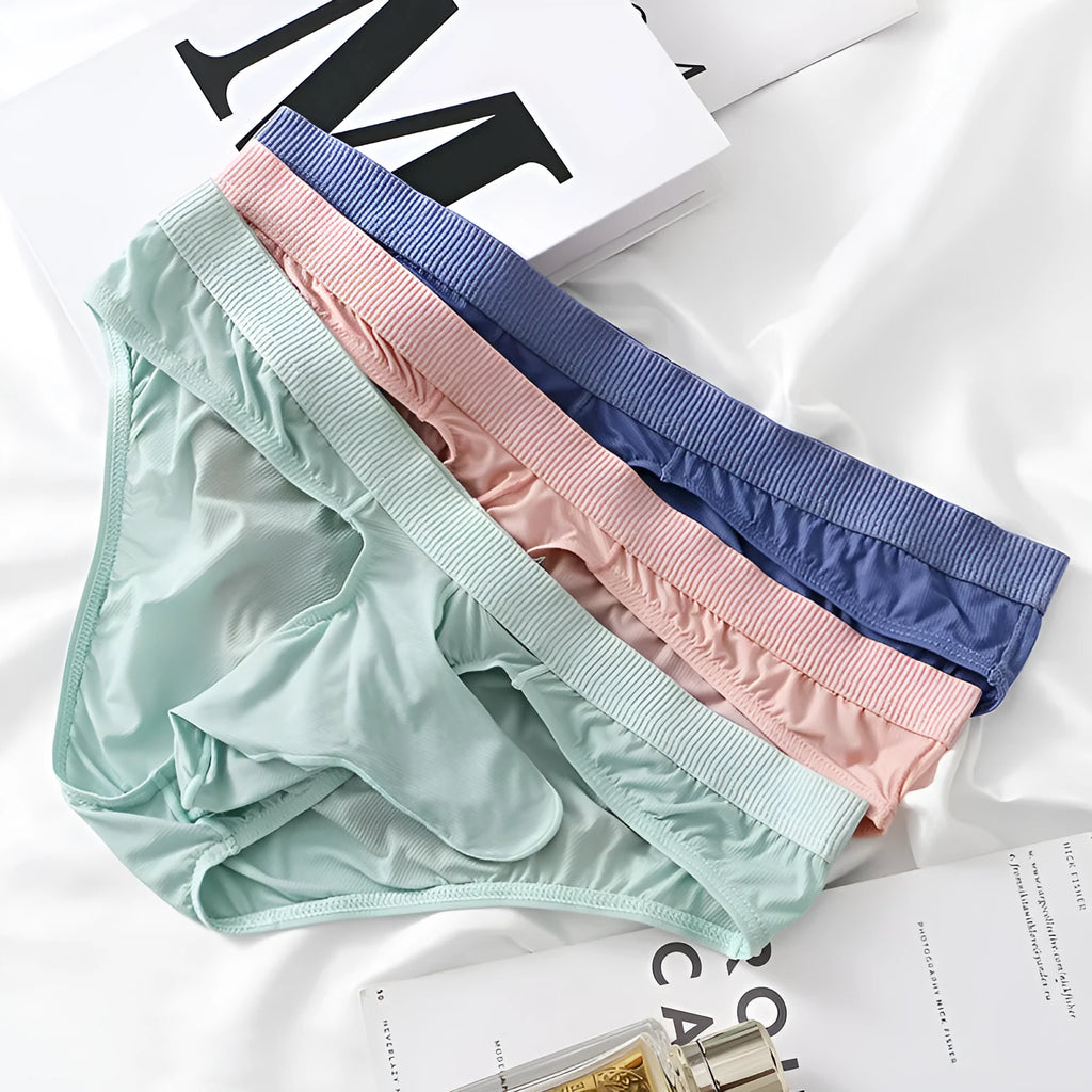 Men's low waist briefs underwear in Ice Silk fabric, showing colour options black, grey, light green, pink, and purple blue.