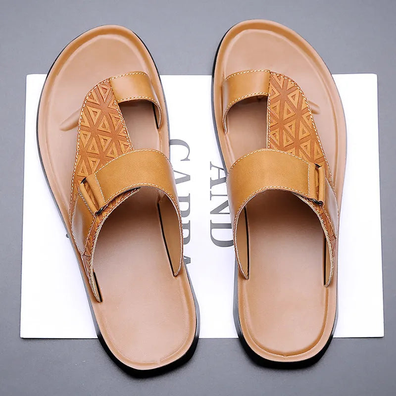 Men's simple beach slippers in light brown cowhide with a rubber sole, shown from the side.