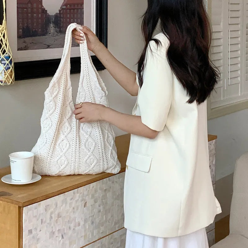 Knitted yarn shoulder tote bag in solid colour with hollow texture and double straps