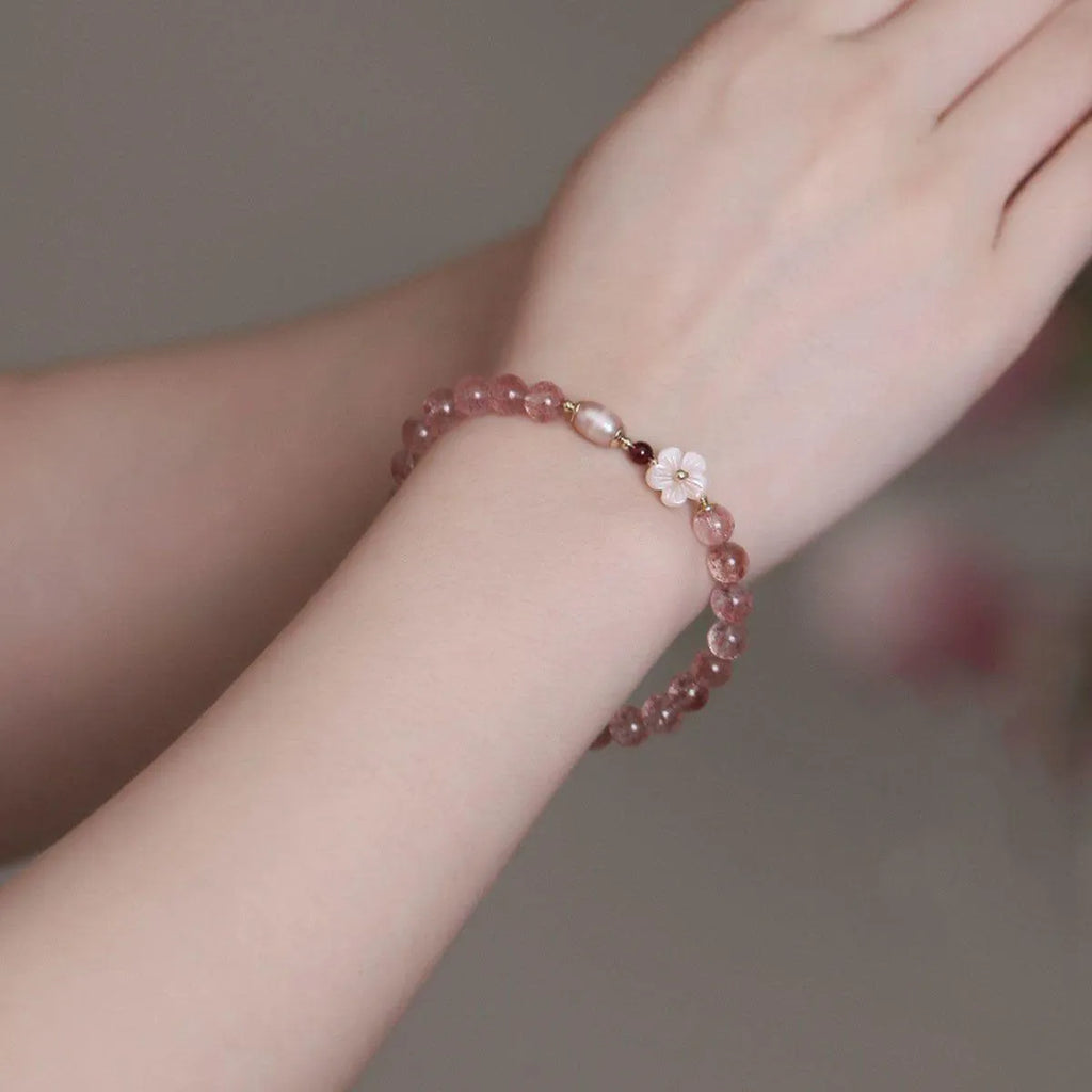 Strawberry quartz peach blossom crystal bracelet with floral design and adjustable cord