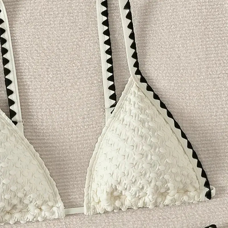 Women's split bikini swimsuit in briefs style available in white or blue colours