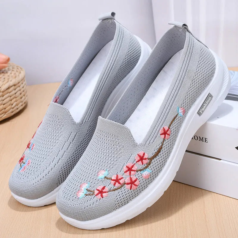 Women's embroidered woven sports pumps in wine red with a low flat heel and round toe.