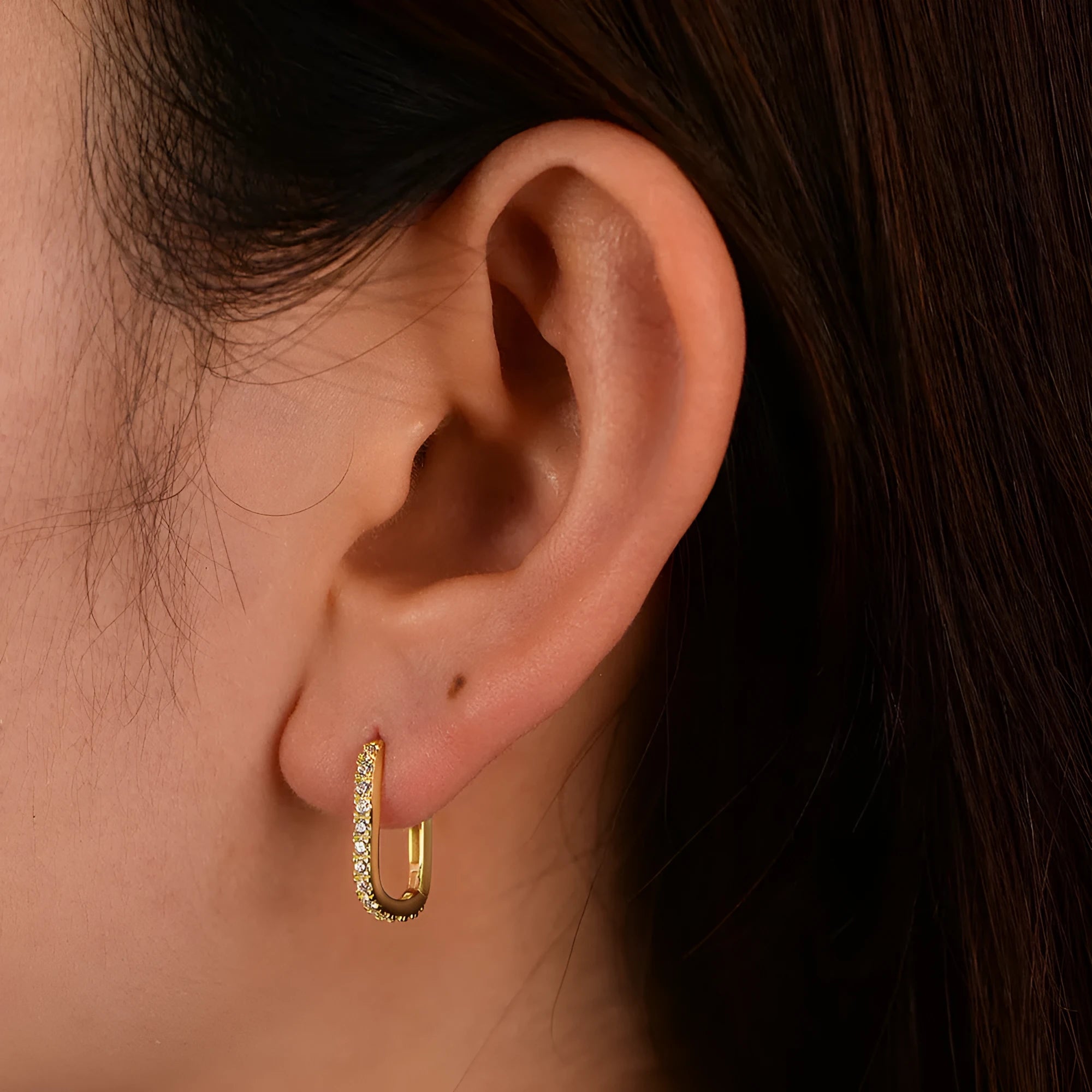 Sterling silver ear clip earrings with oval zircon stones in geometric design