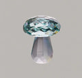 Colourful white crystal mushroom decorative craft in modern geometric style on a desk.
