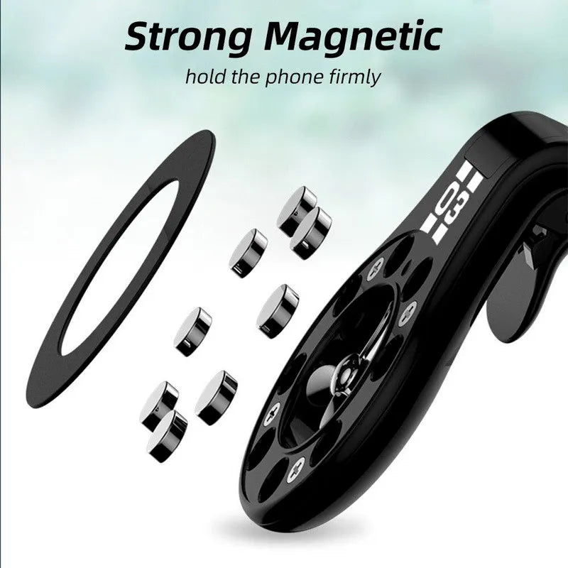 Black magnetic car air vent phone holder with adjustable head and fragrance slices attached to a vehicle vent.