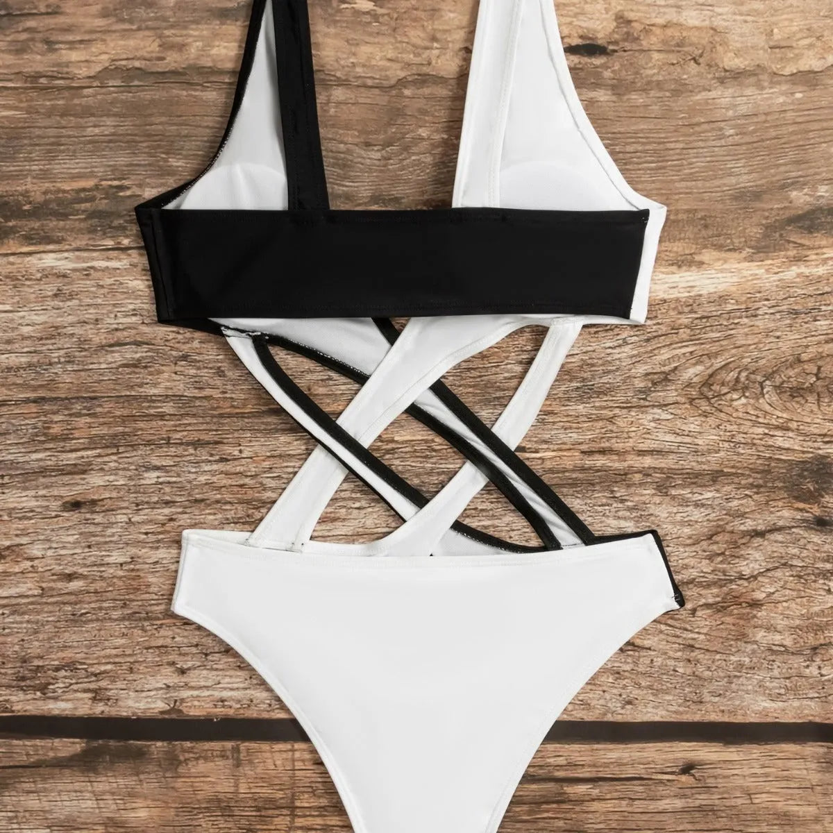 White women's one-piece swimsuit with hollow out colour blocking design.