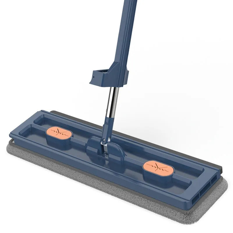 Large flat mop with long stainless steel handle and blue cleaning cloth on a hard floor