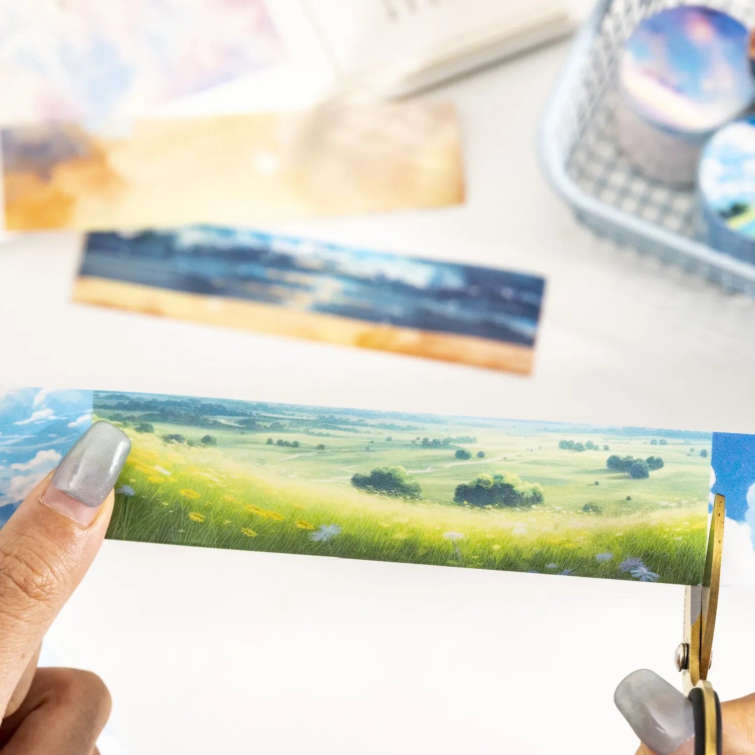 Roll of Japanese paper sky theme washi tape showing colourful clouds design, 30mm wide.