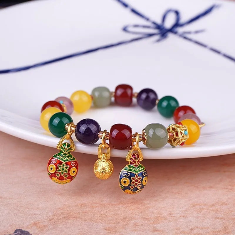Hand-woven swallowing gold beast charm on 10mm agate bead bracelet