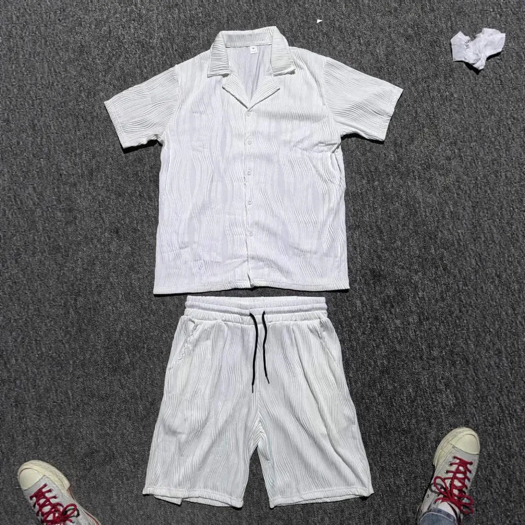 Men's black wave pattern shorts suit set with short sleeve shirt and matching shorts on hanger