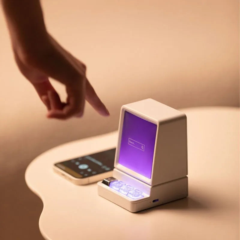 Portable computer-shaped Bluetooth speaker in light grey with lighting and voice prompt function