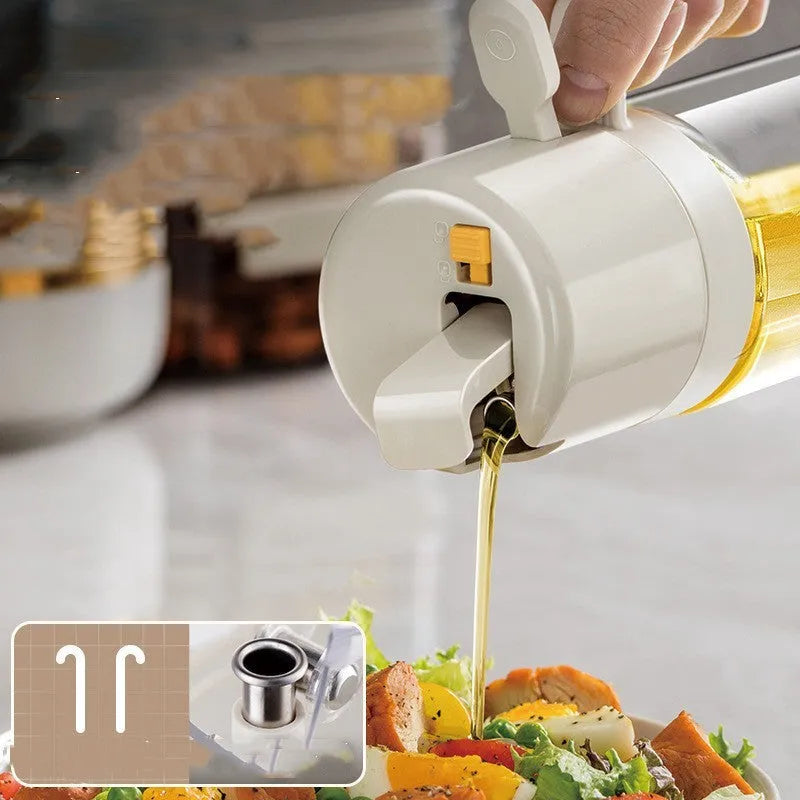 Glass oil sprayer bottle with grey cap, shown in spray and pour modes next to cooking ingredients.