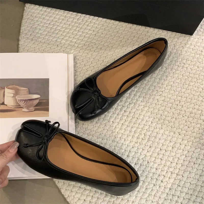Women's flat split-toe pumps in black, silver, beige, and red with an oversleeve design.