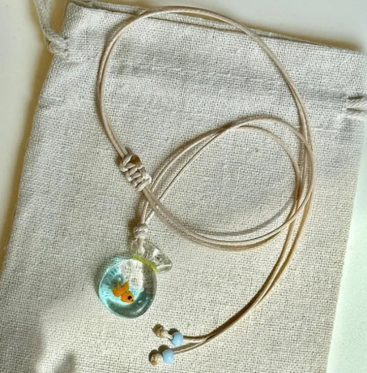 Women's necklace with a coloured glaze Skirt Everyday Joker pendant on a cotton and linen clavicle chain.