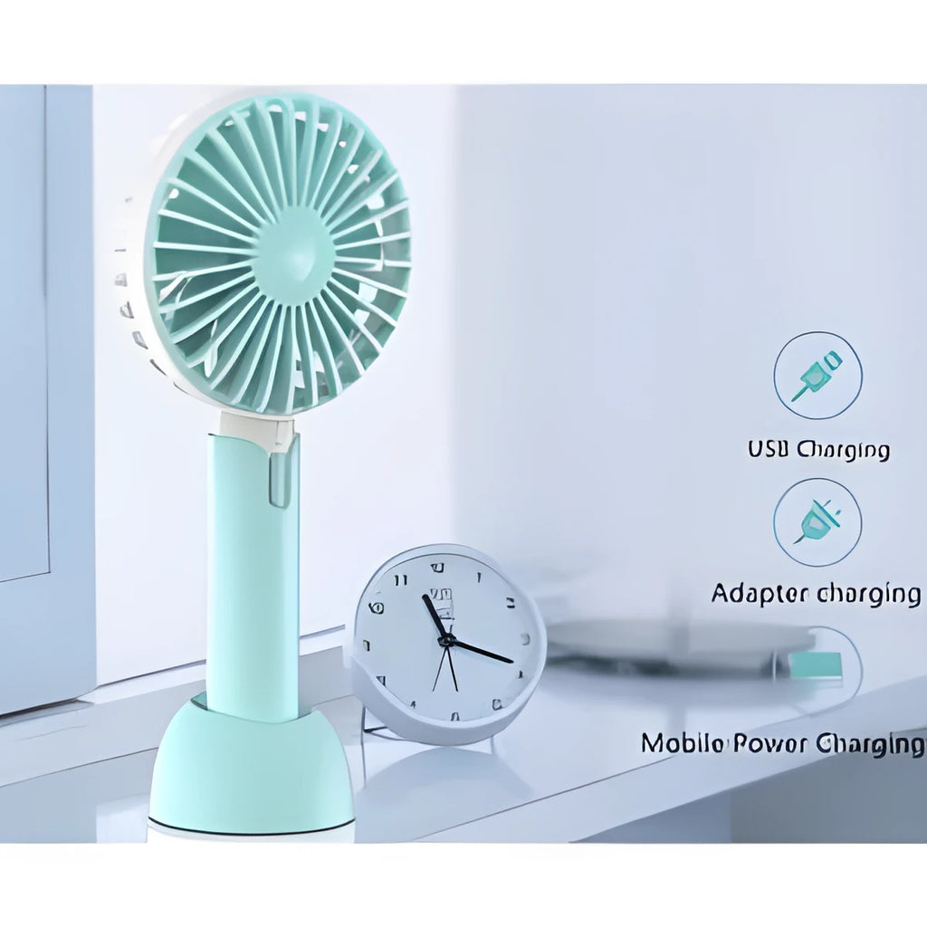 Blue handheld mini USB electric fan with three-speed control on a desktop.