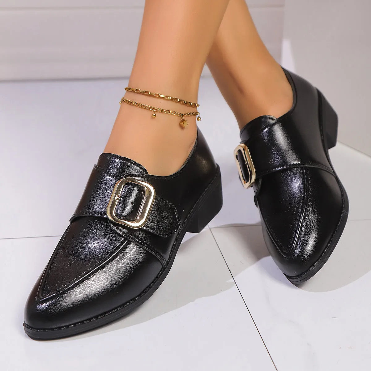 Women's beige PU leather slip-on shoes with a large bow decoration and rubber sole.