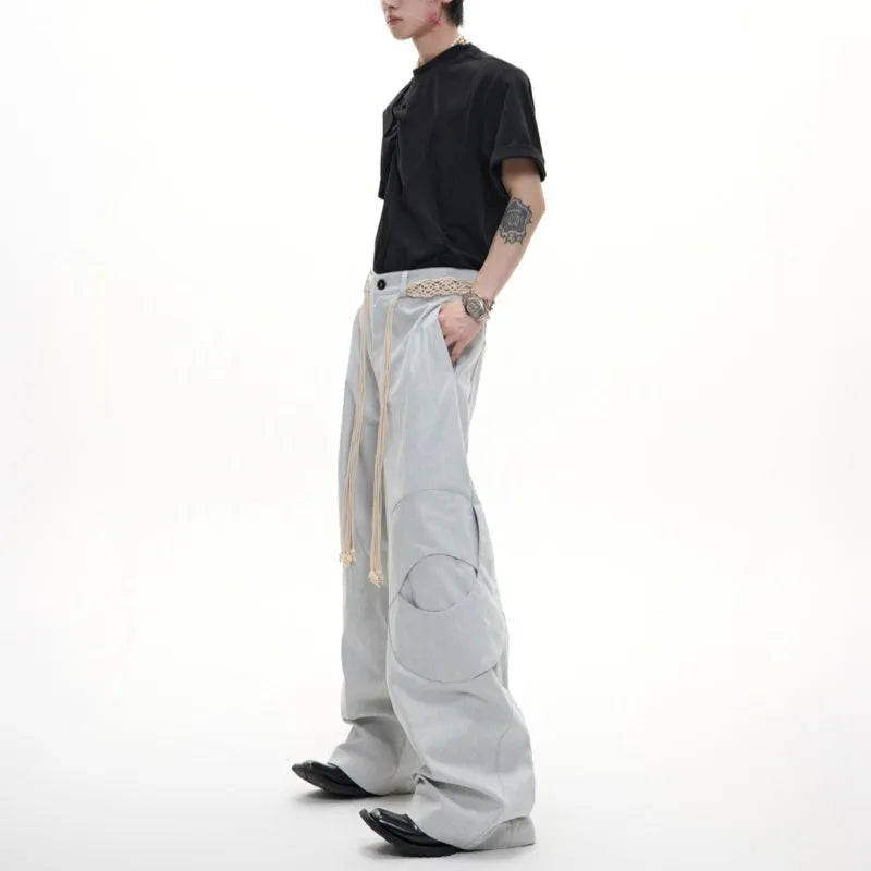 Men's straight-leg cotton trousers with loose fit, zip decorations and tassel detailing in dark colour options