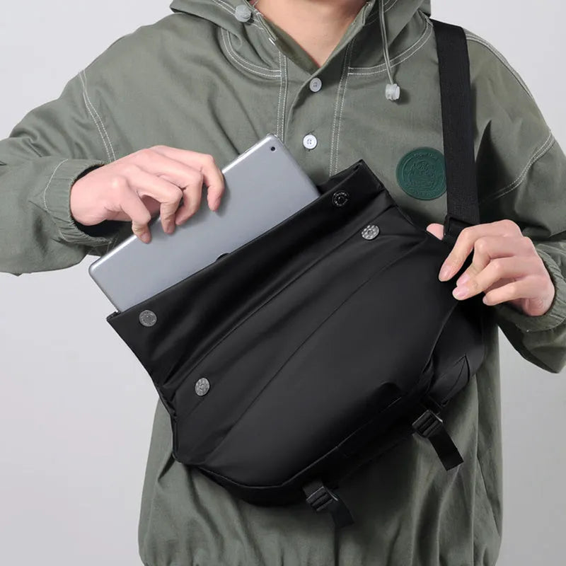 Grey men's crossbody sling bag made of PU leather with a zip opening and shoulder strap.