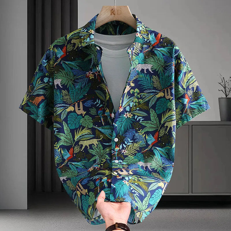Men's short sleeve cotton shirt with colourful Hawaiian floral print, cardigan style, on a hanger.