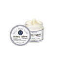 A 60g glass or plastic jar of Cow Fat Moisturising Cream with honey and vitamins