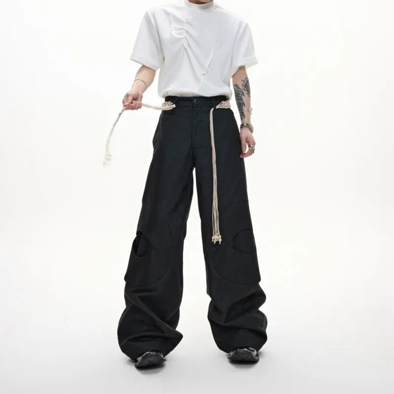 Men's straight-leg cotton trousers with loose fit, zip decorations and tassel detailing in dark colour options