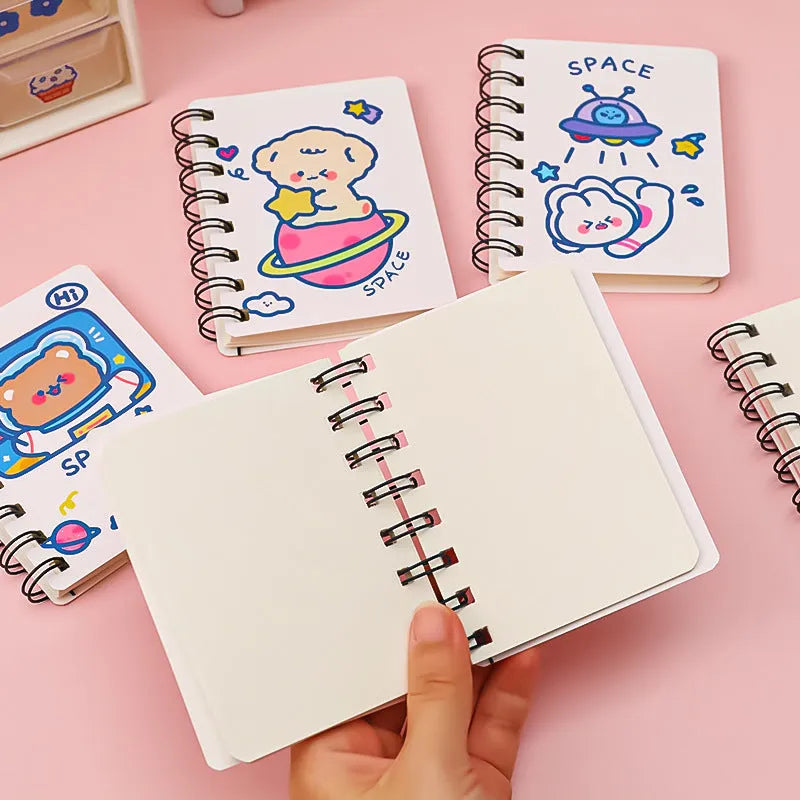 Astronaut series pocket notebook in 10.5cm by 8cm size, showing cover options: Astronaut Bear, Planet Teddy, Space Cat, UFO.