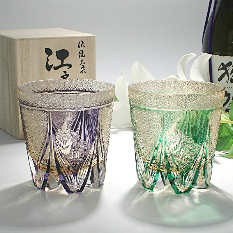Crystal whiskey glass in simple style, colour Bluish Gray Fluorite, on a table