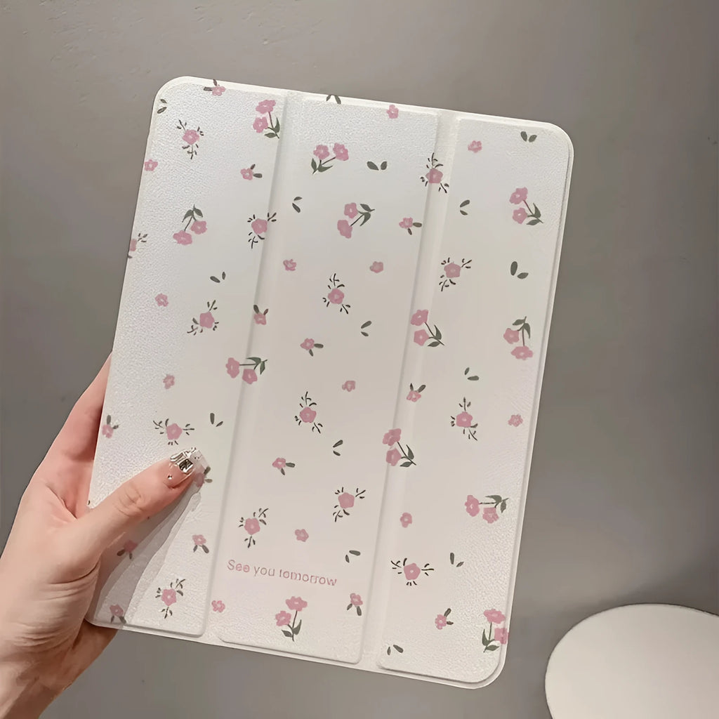 Transparent floral tri-fold iPad case showing magnetic stand function and clear polycarbonate construction