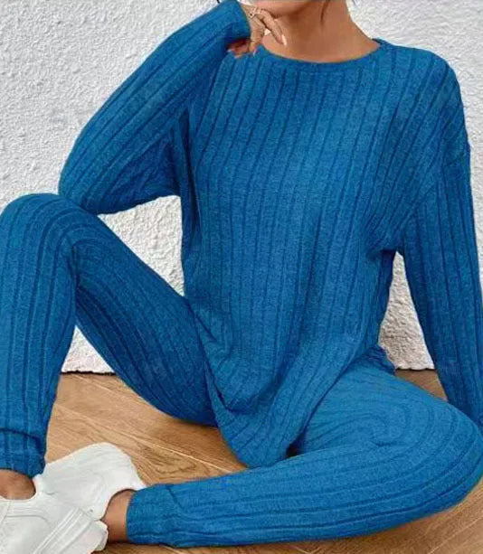 Sunken stripe black polyester two-piece homewear set showing trousers and top on Asian size mannequin