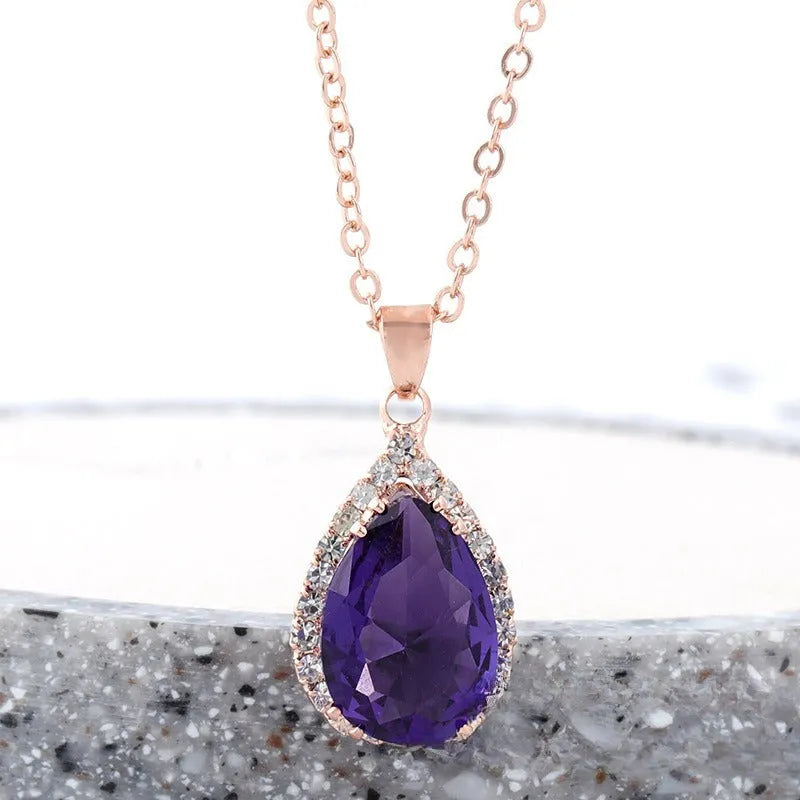 Geometric drop shape alloy necklace with rhinestone accents in rose gold pink finish
