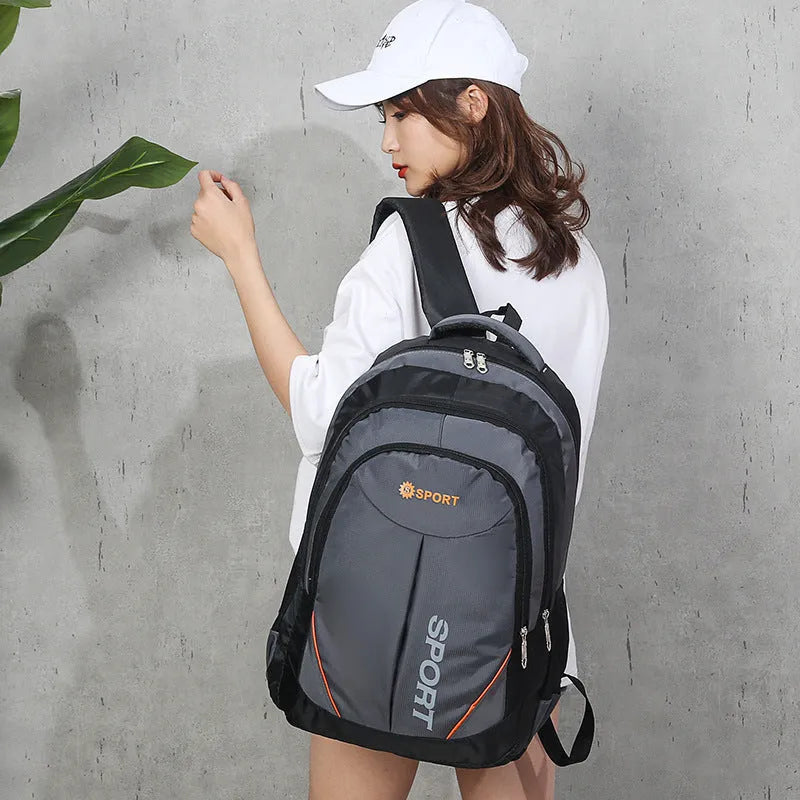 Nylon backpack with curved shoulder straps shown in red colour with letter detailing